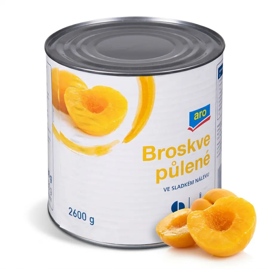 Velká plechovka s půlenými loupanými broskvemi v nálevu